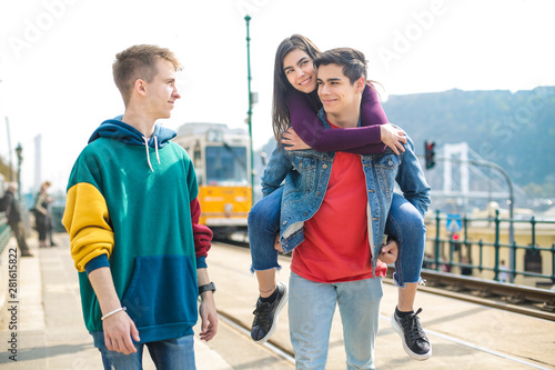 Friends having fun, playing in the street
