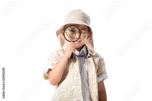 front view of explorer child in hat and glasses holding magnifying glass isolated on white