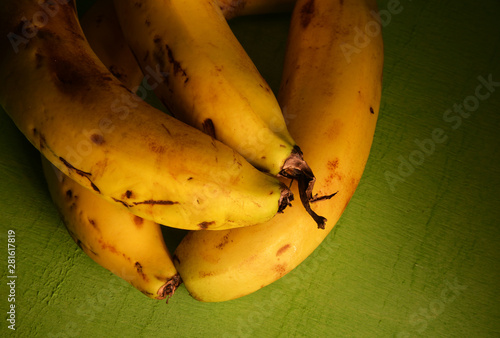 organic bananas in green background