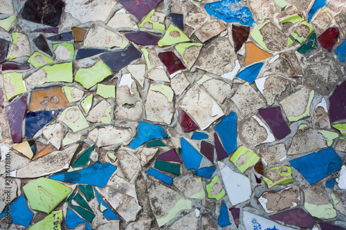 old path of glass fragments and pieces of ceramics in concrete, top view, selective focus
