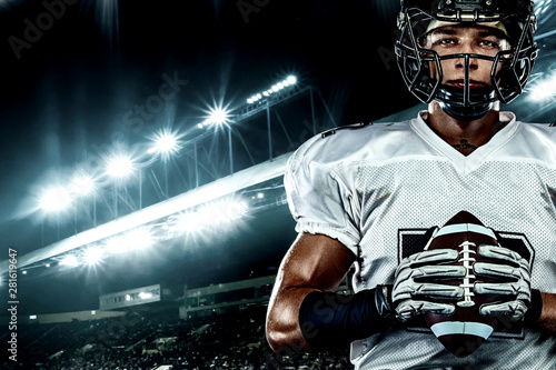 American football player, in helmet on stadium. Sport action concept. © Mike Orlov