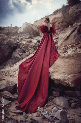 Girl in a red dress with a long skirt