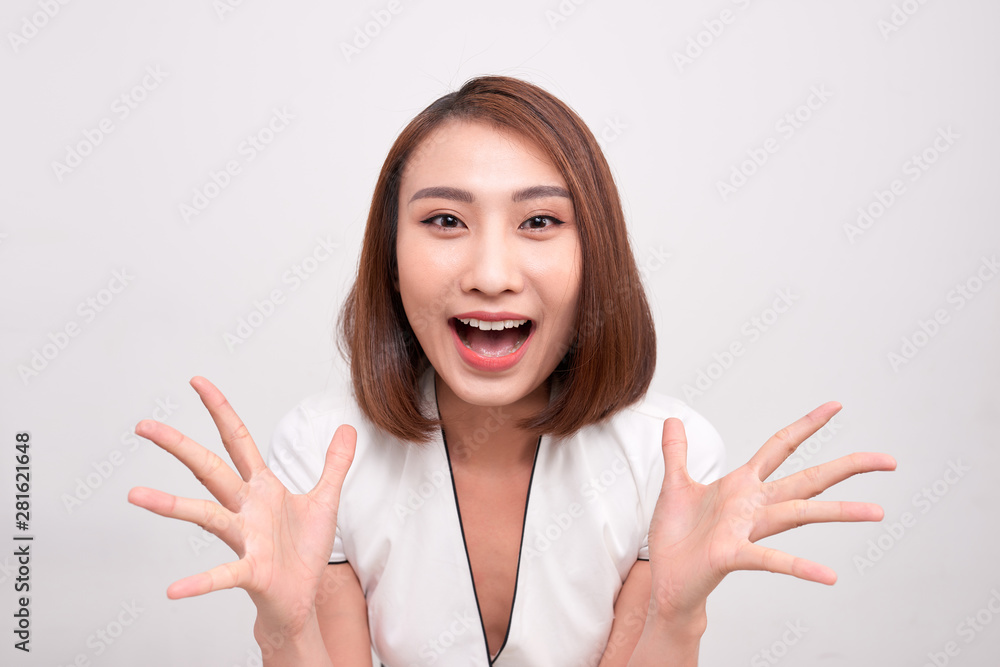 Asian woman touching her face with surprise feeling, with joy and happiness Asian woman touching her face with surprise feeling, with joy and happiness