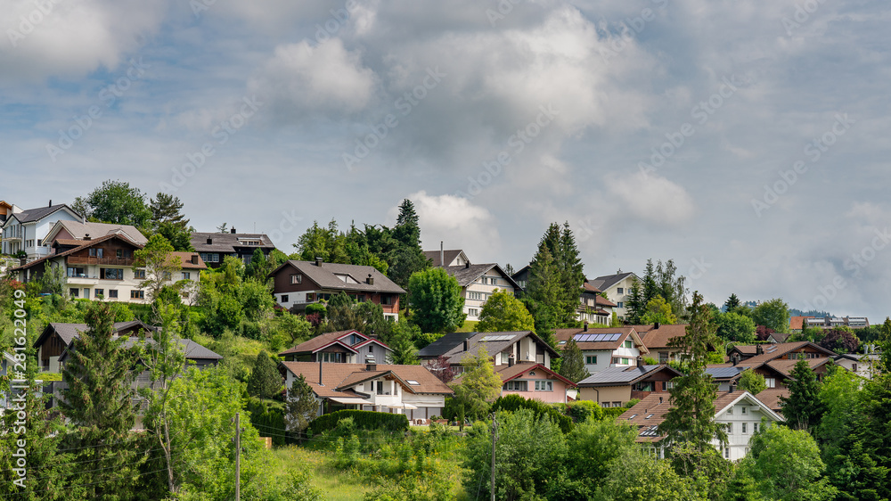 Beautiful swiss farm houses on the hill Beautiful swiss farm houses on the hill
