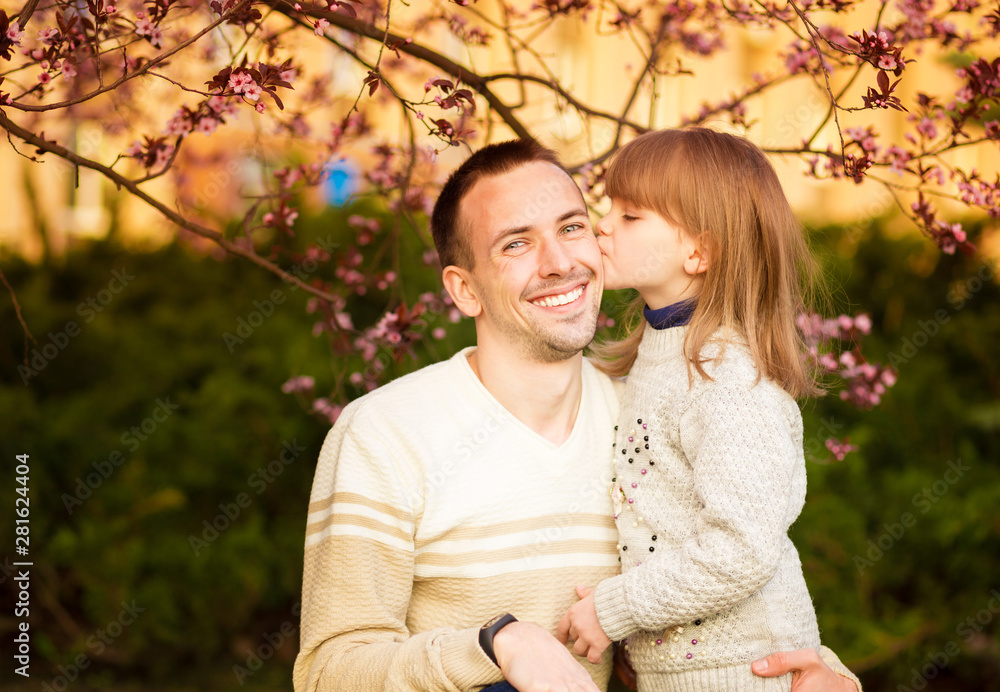Fototapeta premium Close up portrait pretty daughter embracing Caucasian father. Family enjoy spend time together. Happy diverse family