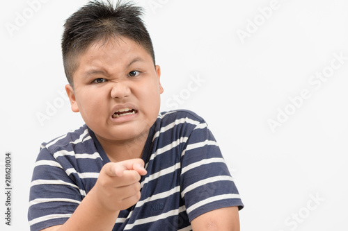 portrait of a angry obese boy isolated