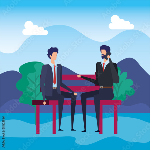 elegant businessmen calling with cellphones in the park chair