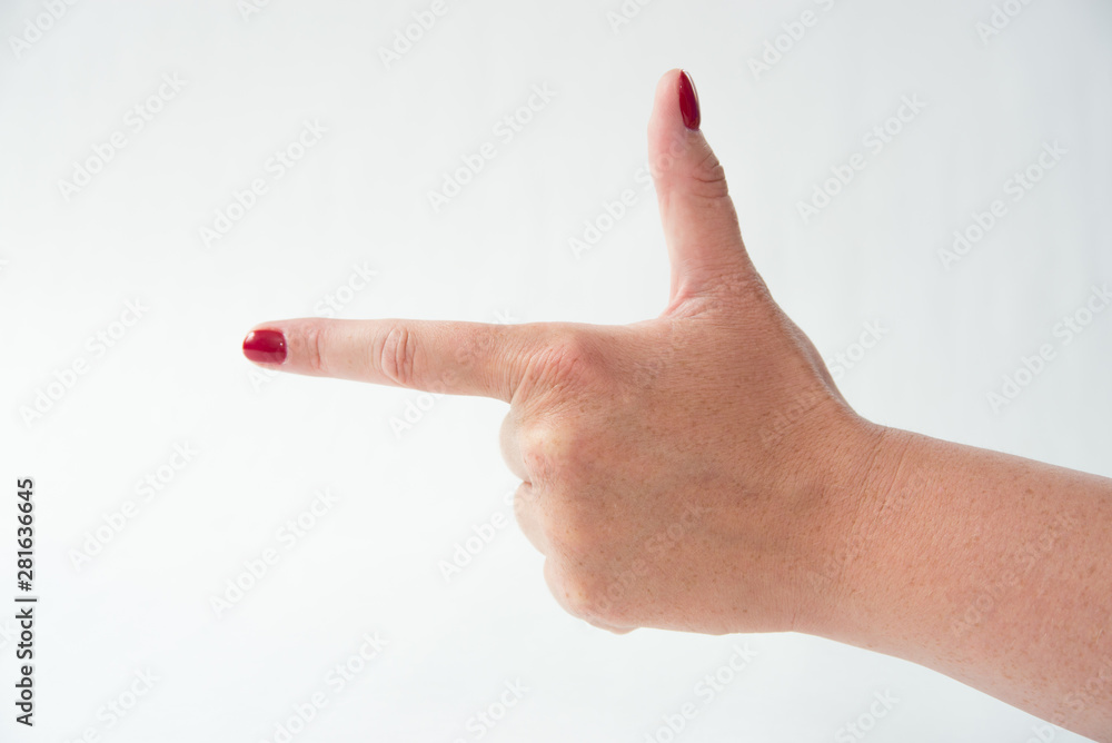 close-up of woman's hand with red nails pointing index finger on white background close-up of woman's hand with red nails pointing index finger on white background