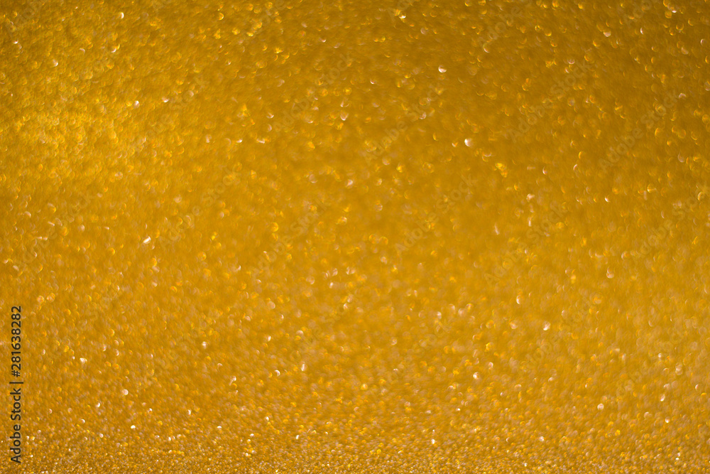 abstract blurred golden background with shiny bokeh abstract blurred golden background with shiny bokeh