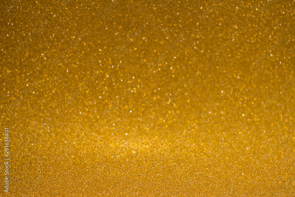 abstract blurred golden background with shiny bokeh