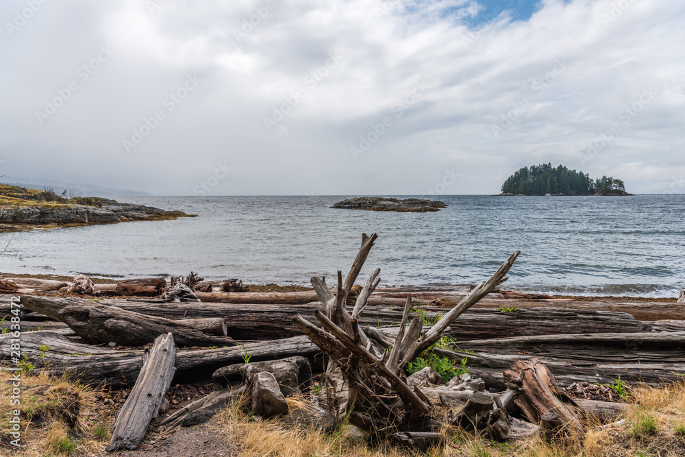 View over Burrard Inlet, ocean and island with boat and mountains in beautiful British Columbia. Canada.