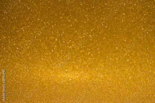 abstract blurred golden background with shiny bokeh