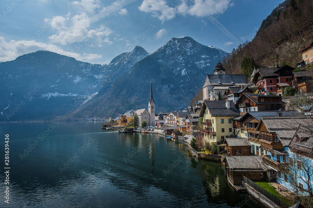 Fototapeta premium Popular scenic view of Hallstatt town, Austria in summer time with blue sky and clear lake