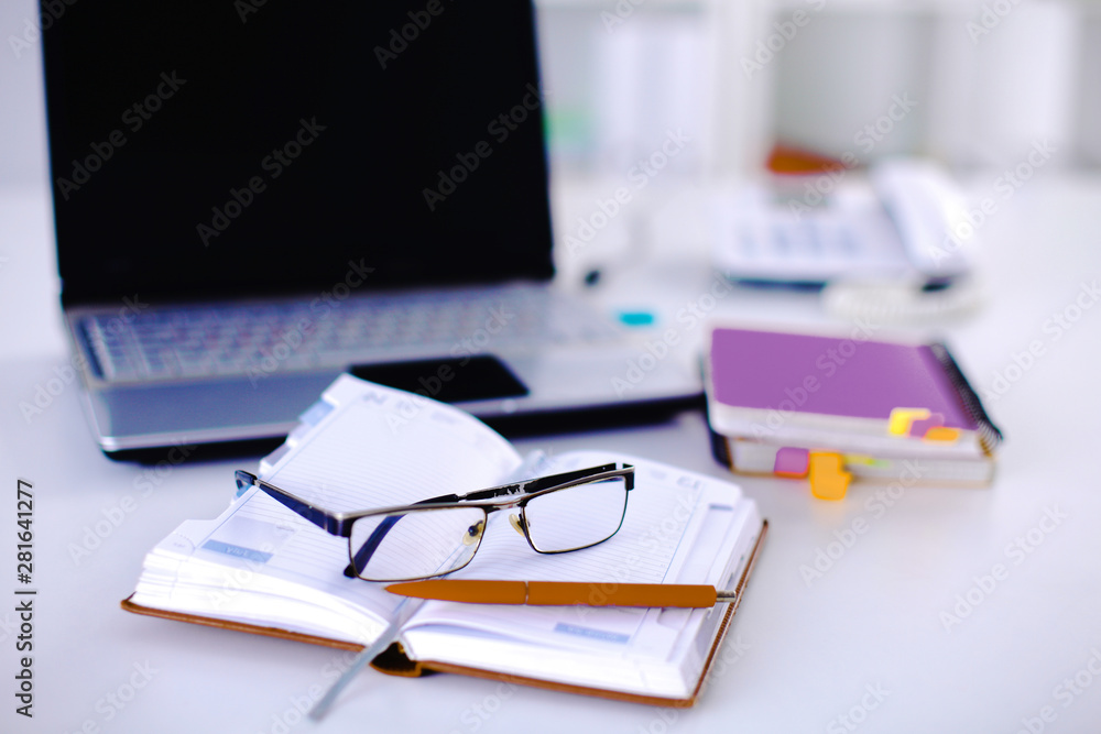 Group of multicolored office folders and glasses Group of multicolored office folders and glasses