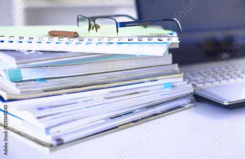 Group of multicolored office folders and glasses