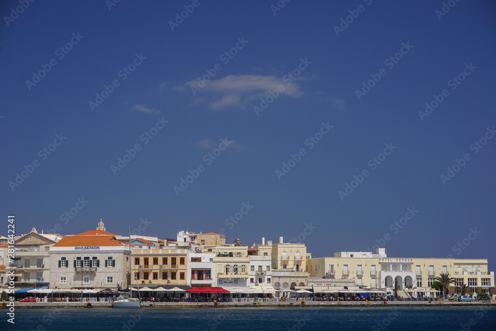 Hermoupolis, Syros, Greece: Hotels and cafes along the waterfront at the port of Syros, a Cyclades Island in Greece.