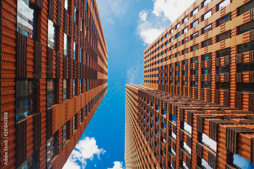 Photography Look up view on orange skyscrapers in Amsterdam business district