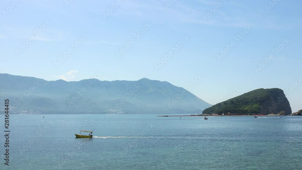 Summer seascape, Sveti Nikola island in Adriatic sea at Montenegro, time lapse panoramic motion Summer seascape, Sveti Nikola island in Adriatic sea at Montenegro, time lapse panoramic motion