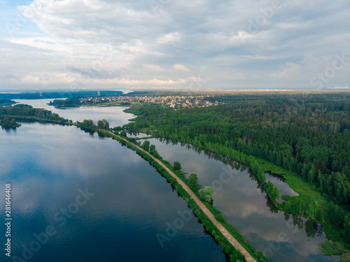 aerial view of a wide river and dirt road