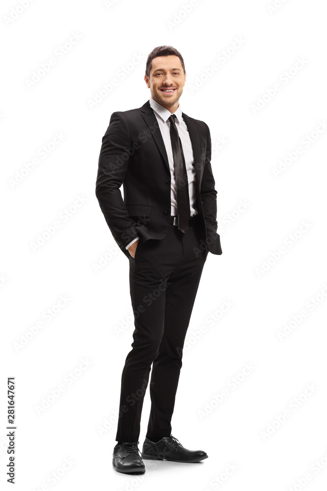 Young man wearing a modern black suit and smiling Young man wearing a modern black suit and smiling