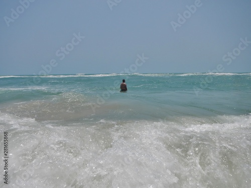  Young man in the blue sea