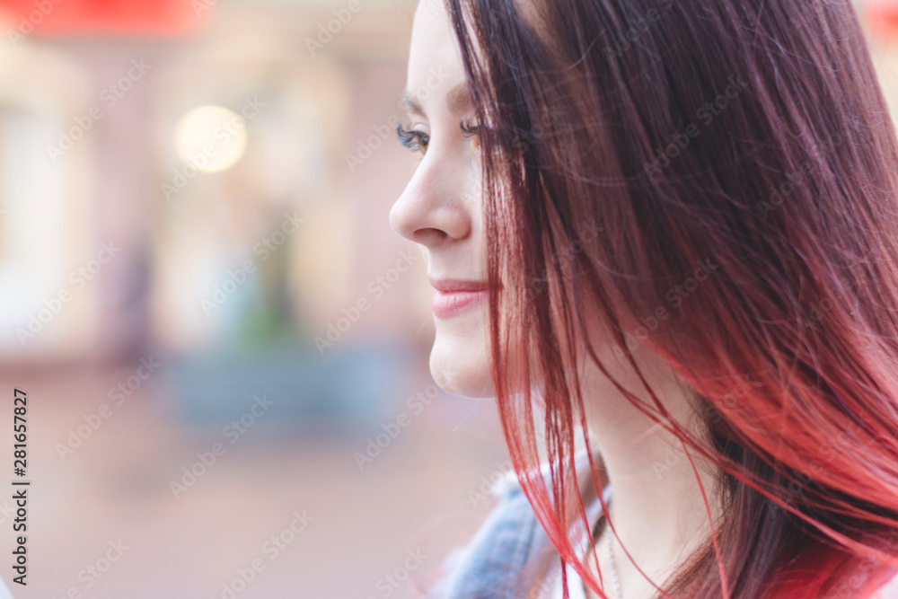 Portrait of a young beautiful girl student with a happy smile on the street on a summer day. Portrait of a young beautiful girl student with a happy smile on the street on a summer day.