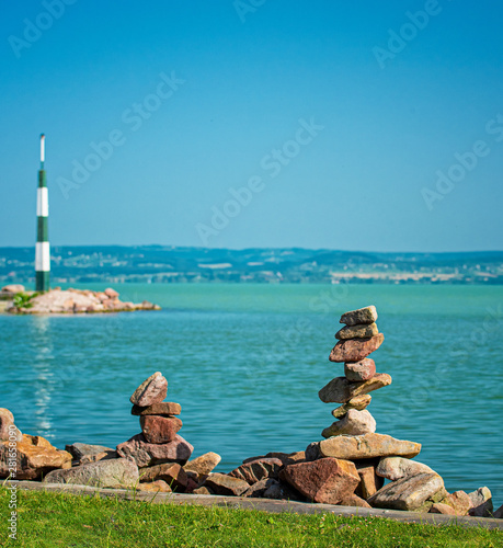 stack of zen stones at lake...