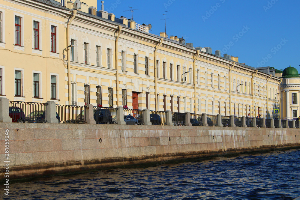 Ancient stone houses on embankment of canal in St. Petersburg