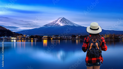Photography Woman traveler with backpack looking to Fuji mountains in Japan.