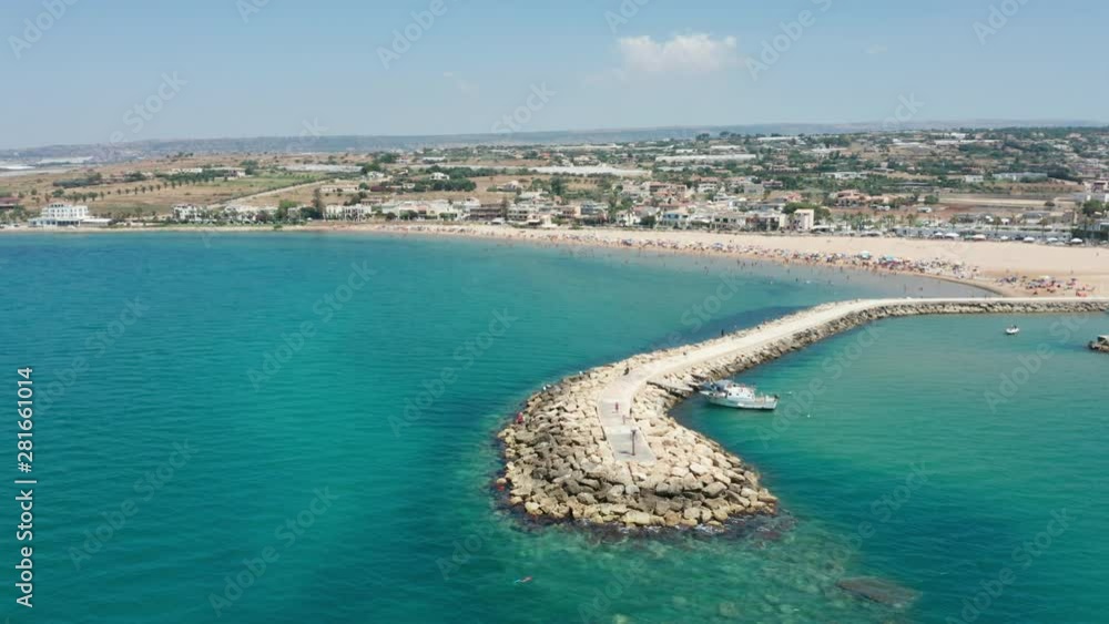 flying around the jetty of Donnalucata beach in Sicily flying around the jetty of Donnalucata beach in Sicily