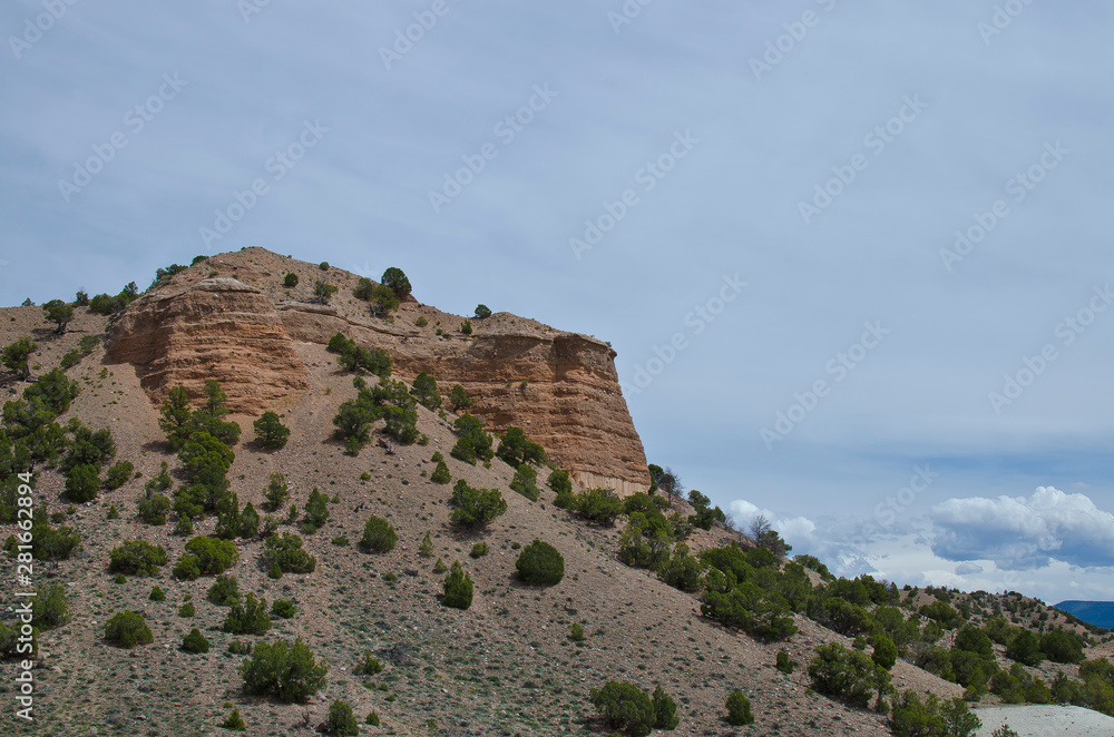 The old dry red rock cliff on the sand cover utah landscape mountains. 