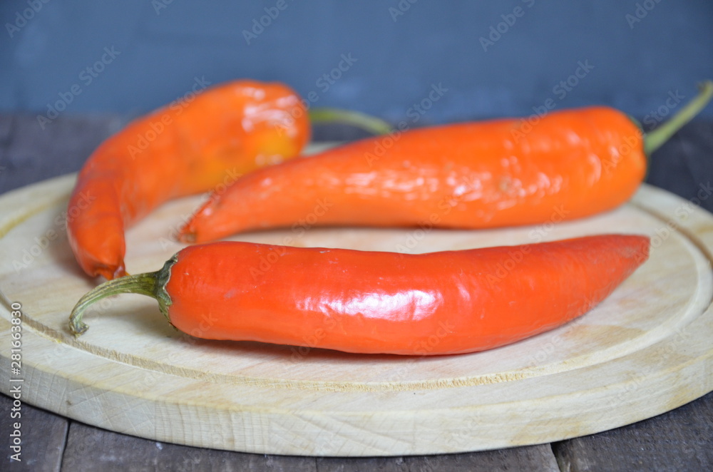 red hot chili pepper corns and pods on dark vintage background, top view red hot chili pepper corns and pods on dark vintage background, top view