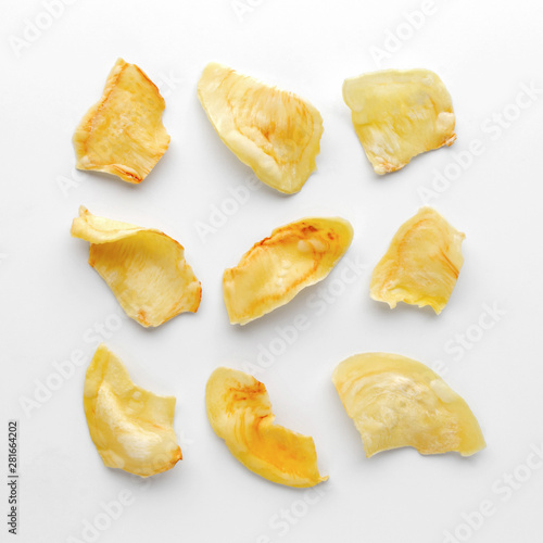 Crispy durian chips on a white background, creative flat lay food concept, top view with clipping path