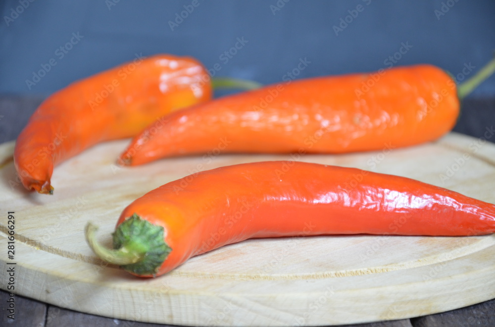 red hot chili pepper corns and pods on dark vintage background, top view red hot chili pepper corns and pods on dark vintage background, top view
