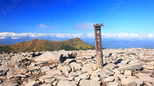 Sign at mountain summit of Yuno Maruyama,  Tomi,  Nagano,  Japan photo