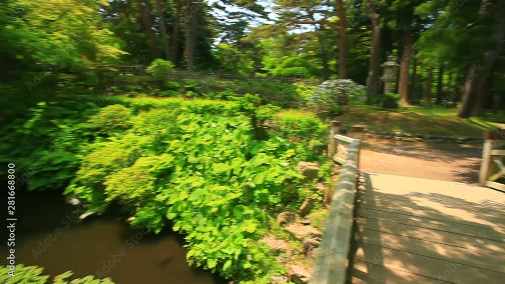 Pond and footbridge in Kosetsu, Hakodate, Japan Pond and footbridge in Kosetsu, Hakodate, Japan