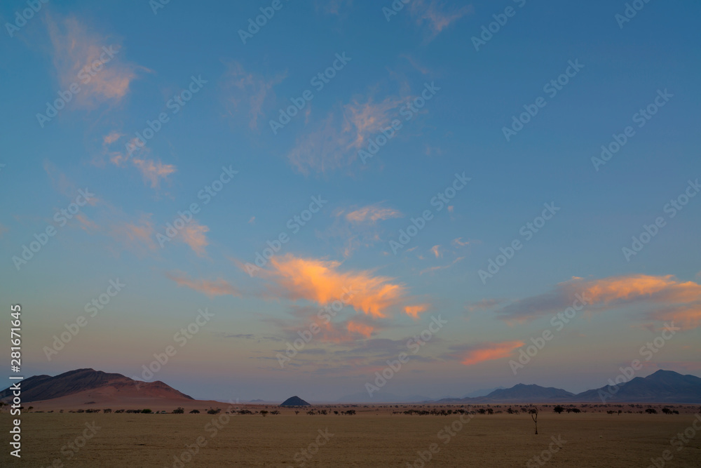 Pink clouds in early morning light in the desert Pink clouds in early morning light in the desert