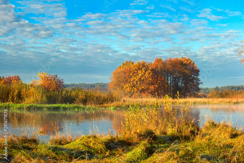 Beautiful autumn landscape. Scenery golden nature on river. Amazing Fall.