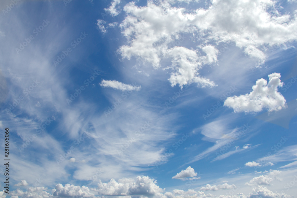 Clouds on a background of blue sky on a clear sunny day Clouds on a background of blue sky on a clear sunny day