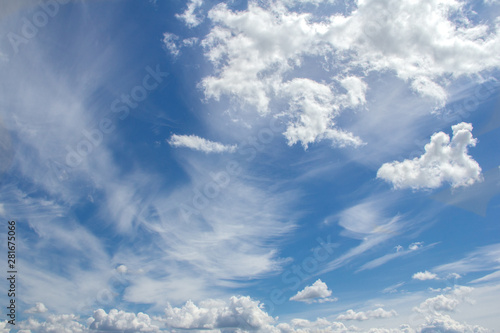 Clouds on a background of blue sky on a clear sunny day