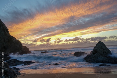 sunset on coast of sea © Terry