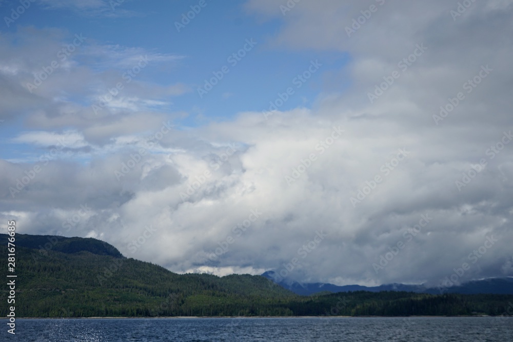 Alaskan Coastline with Mountains and Clouds