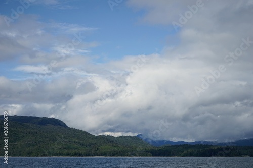 Alaskan Coastline with Mountains and Clouds