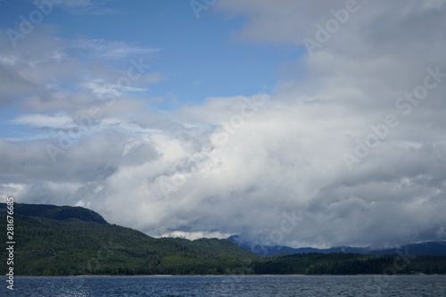 Alaskan Coastline with Mountains and Clouds