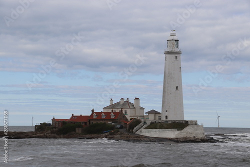 Large white lighthouse on an island 