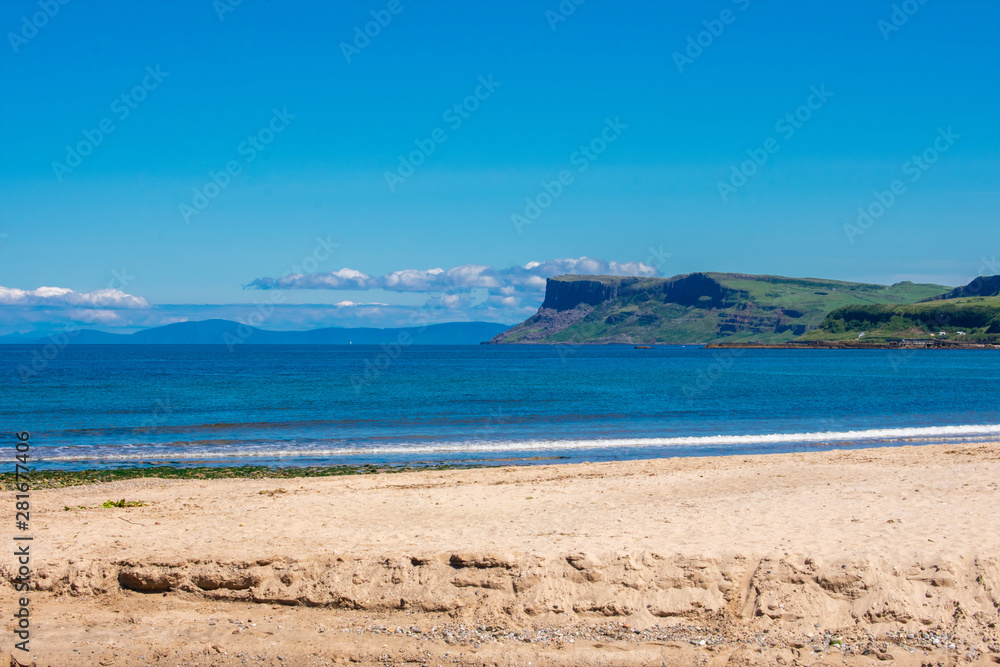 Coast of Atlantic Ocean in Ballycastle Northern Ireland. Summer sunny day, clear blue sky  