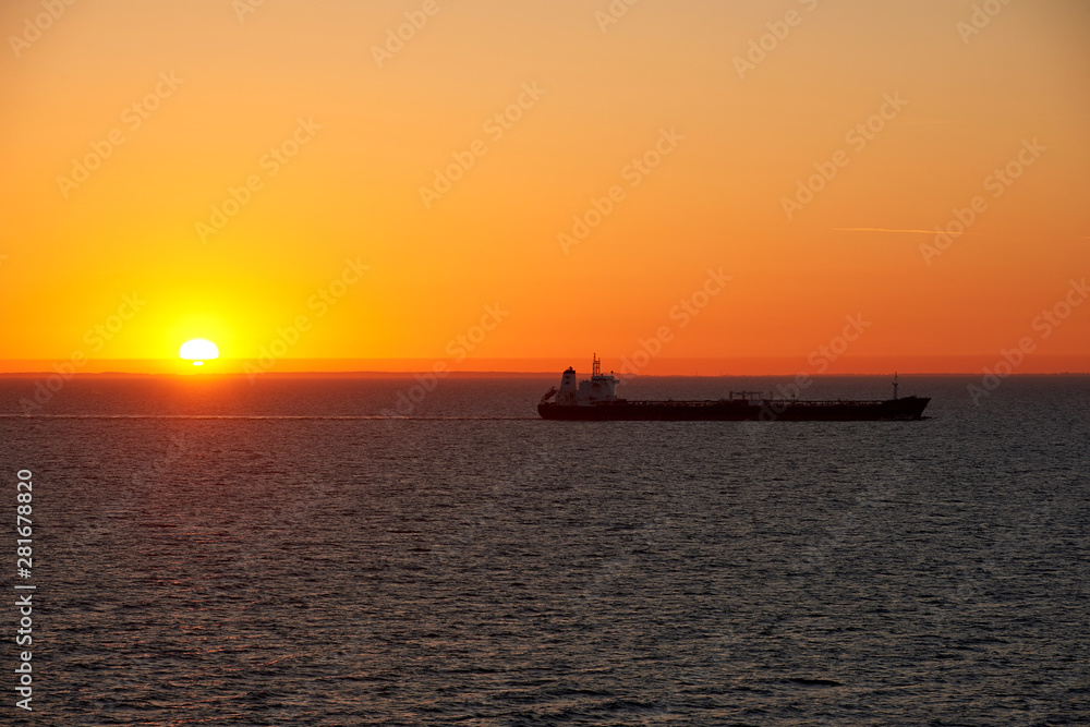 sunset above ocean while cruising through sea