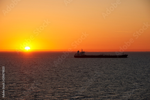sunset above ocean while cruising through sea © fotowunsch