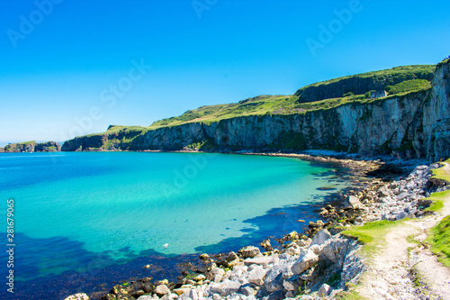 Carrick a Rede Rope Bridge in Ballintoy, Northern Ireland. Beautiful Landscape on Coast of Atlantic Ocean, Clear blue and green water 