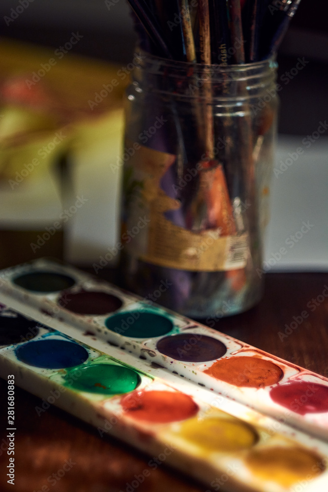 watercolor paints on the table